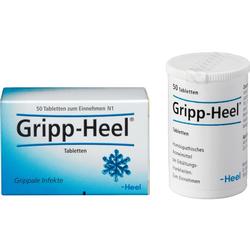 Eine Packung und ein Behälter von Gripp-Heel-Tabletten gegen Erkältung.